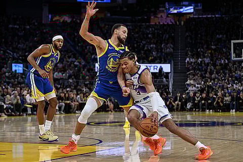 Utah Jazz guard Keyonte George (3) dribbles against Golden State Warriors guard Stephen Curry (30) during the second half of an NBA basketball game in San Francisco.