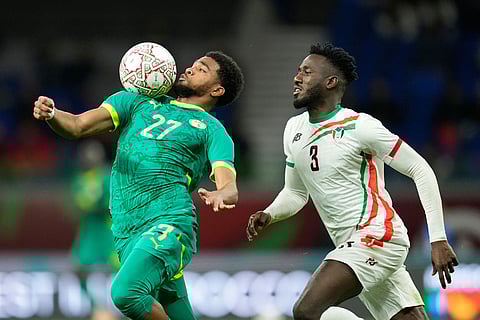 Senegal's Ibrahim Mbaye receives the ball in front of Sudan's Mohamedahmed Saeed Ahmed during the Africa Cup of Nations best of 16 soccer match between Senegal and Sudan in Tangier, Morocco.