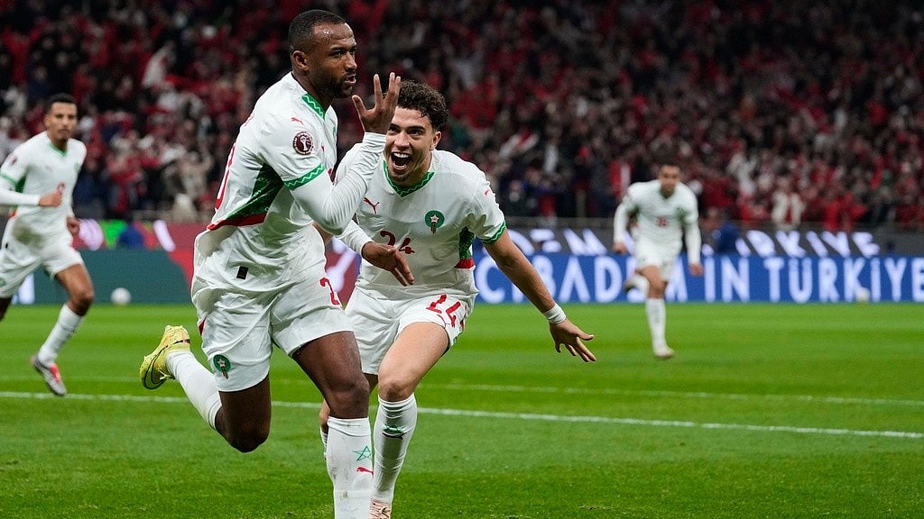 Morocco's Ayoub El Kaabi, left, celebrates with his teammate Neil Yoni El Aynaoui after scoring his side's first goal during the Africa Cup of Nations group A match against Zambia in Rabat. - Photo: AP