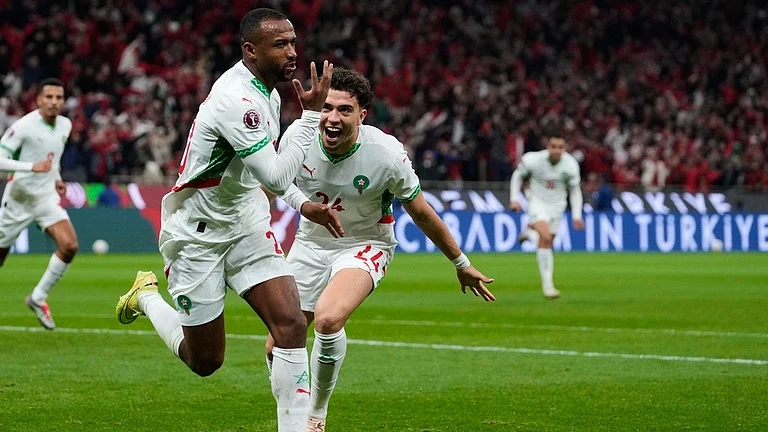 Morocco's Ayoub El Kaabi, left, celebrates with his teammate Neil Yoni El Aynaoui after scoring his side's first goal during the Africa Cup of Nations group A match against Zambia in Rabat. - Photo: AP