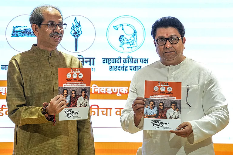 Shiv Sena (UBT) chief Uddhav Thackeray, left, and Maharashtra Navnirman Sena (MNS) chief Raj Thackeray release their alliance manifesto for the upcoming civic polls, at Sena Bhavan, in Mumbai. - | Photo: PTI/Kunal Patil