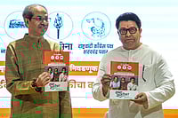 | Photo: PTI/Kunal Patil : Shiv Sena (UBT) chief Uddhav Thackeray, left, and Maharashtra Navnirman Sena (MNS) chief Raj Thackeray release their alliance manifesto for the upcoming civic polls, at Sena Bhavan, in Mumbai.