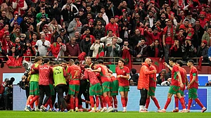 Photo: AP : Moroccan players celebrate after teammate Brahim Diaz scored the winning goal during the Africa Cup of Nations round of 16 match against Tanzania in Rabat.
