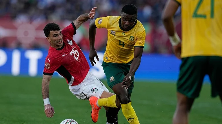 South Africa's Teboho Mokoena is challenged by Egypt's Ahmed Zizo during the Africa Cup of Nations group B soccer match between Egypt and South Africa in Agadir, Morocco. - | Photo: AP/Themba Hadebe