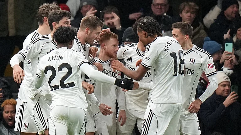Fulham's Harrison Reed, centre, celebrates after scoring his side's second goal during the English Premier League match against Liverpool in London. - Photo: AP