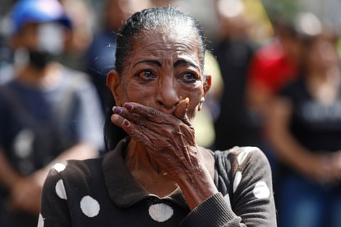 A woman cries during a rally of supporters of Venezuelan President Nicolás Maduro in Caracas, Venezuela, after U.S. President Donald Trump announced Maduro had been captured and flown out of the country.