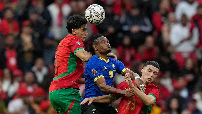 Tanzania's Selamani Mwalimu, centre, fights for the ball with Morocco's Nayef Aguerd, left and Bilal El Khannouss during the Africa Cup of Nations round of 16 match in Rabat. - Photo: AP