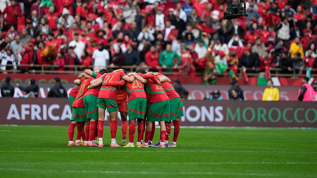Moroccan players huddle before the start of the Africa Cup of Nations round of 16 match between Morocco and Tanzania in Rabat. - Photo: AP