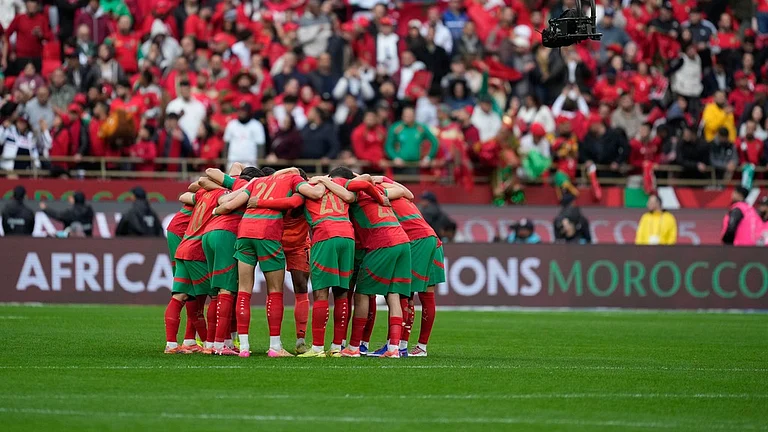 Moroccan players huddle before the start of the Africa Cup of Nations round of 16 match between Morocco and Tanzania in Rabat. - Photo: AP