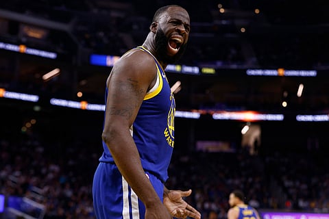Golden State Warriors forward Draymond Green (23) argues with the officials for the lack of the three-second rule in the second quarter during an NBA basketball game against the Utah Jazz in San Francisco.