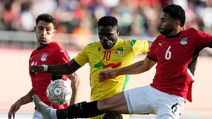 AP : Egypt's Yasser Ibrahim, right, and Hamdy Fathy, left, defend against Benin's Tosin Aiyegun during the Africa Cup of Nations round of 16 soccer match.