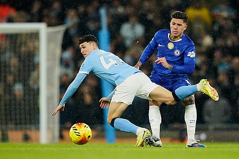Chelsea's Enzo Fernandez, right, challenges Manchester City's Phil Foden during the English Premier League soccer match between Manchester City and Chelsea in Manchester, England.