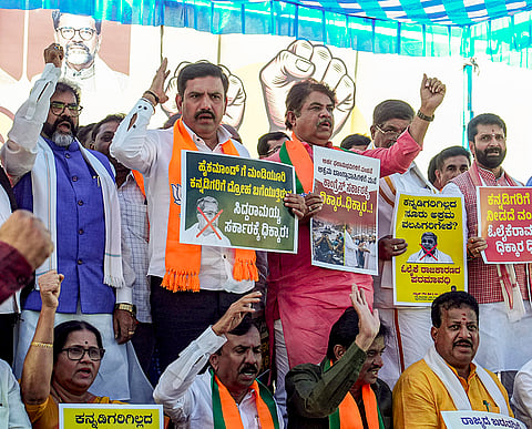 Karnataka BJP President B Y Vijayendra, Leader of the Opposition in the Legislative Assembly R Ashoka, Leader of the Opposition in the Legislative Council Chalavadi Narayanaswamy and other party leaders during a protest under the slogan 'Save Kogilu, Remove Illegal Immigrants' over the state government's move to provide houses to those who lost their dwellings in an eviction of encroachments in Kogilu recently, in Bengaluru, Karnataka. 