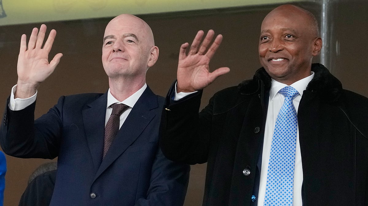 CAF President Patrice Motsepe and FIFA President Gianni Infantino wave from the tribune during the Africa Cup of Nations round of 16 soccer match between South Africa and Cameroon in Rabat, Morocco, Sunday, Jan. 4, 2026. - | Photo: AP/Themba Hadebe