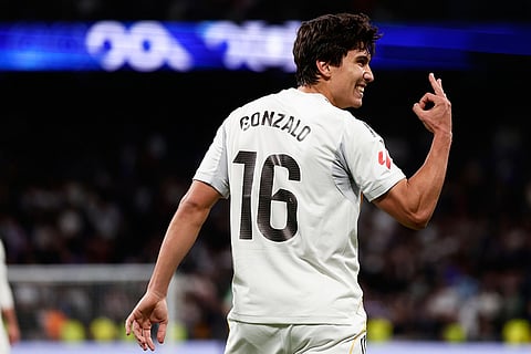 Real Madrid's Gonzalo Garcia celebrates after scoring his third and his sides fourth goal during the Spanish La Liga soccer match between Real Madrid and Real Betis Sevilla in Madrid, Spain.