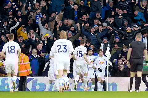 Leeds United's Brenden Aaronson, right, celebrates with his teammates after scoring his sides first goal during the English Premier League soccer match between Leeds United and Manchester United in Leeds, England.