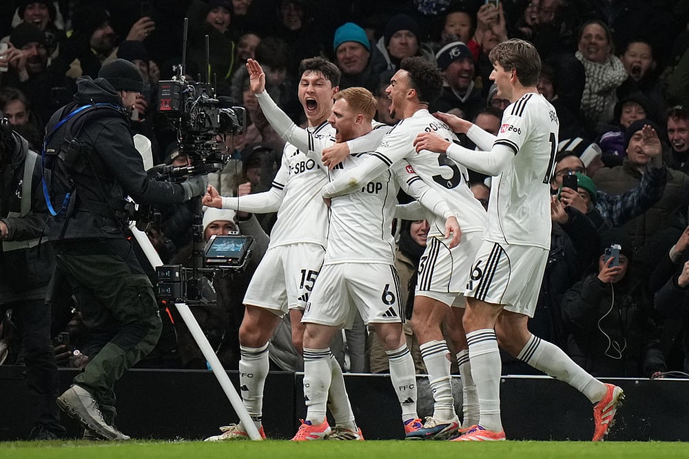 Fulham's Harrison Reed celebrates after scoring his side's second goal during the English Premier League soccer match between Fulham and Liverpool in London. - | Photo: AP/Alastair Grant