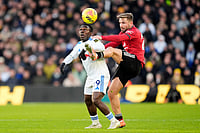 | Photo: Danny Lawson/PA via AP : Leeds United's Wilfried Gnonto, left, and Manchester United's Luke Shaw battle for the ball during the English Premier League soccer match between Leeds United and Manchester United in Leeds, England.