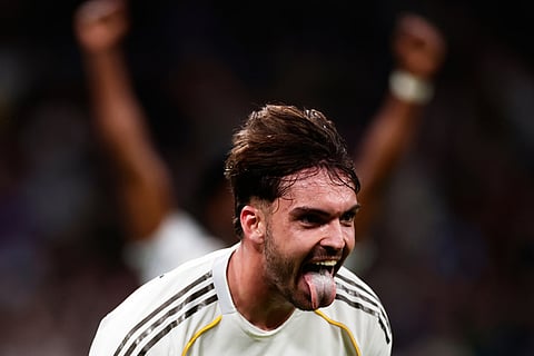 Real Madrid's Raul Asencio celebrates after scoring his sides third goal during the Spanish La Liga soccer match between Real Madrid and Real Betis Sevilla in Madrid, Spain.