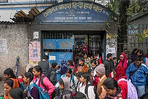 | Photo: PTI : Students with their parents outside Tollygunge Adarsha Hindi High School amid concerns over the dilapidated condition of government schools, in Kolkata.
