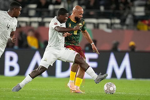 South Africa's Mbekezeli Mbokazi and Cameroon's Bryan Mbeumo challenge for the ball during the Africa Cup of Nations round of 16 soccer match between South Africa and Cameroon in Rabat, Morocco.