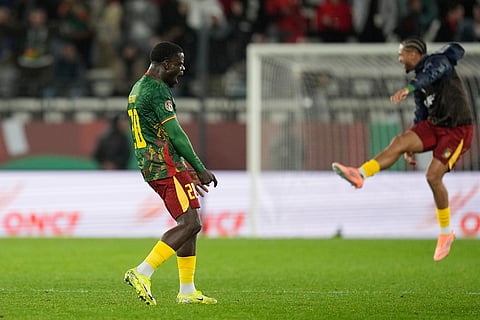 Cameroon's Olivier Kemen celebrates after winning the Africa Cup of Nations round of 16 soccer match between South Africa and Cameroon in Rabat, Morocco.