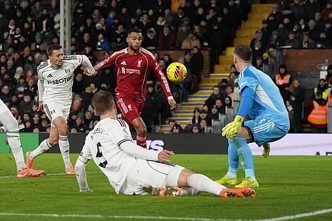 Liverpool's Cody Gakpo scores his side's second goal during the English Premier League soccer match between Fulham and Liverpool in London.