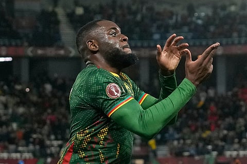 Cameroon's Junior Tchamadeu celebrates after he scored the opening goal during the Africa Cup of Nations round of 16 soccer match between South Africa and Cameroon in Rabat, Morocco.