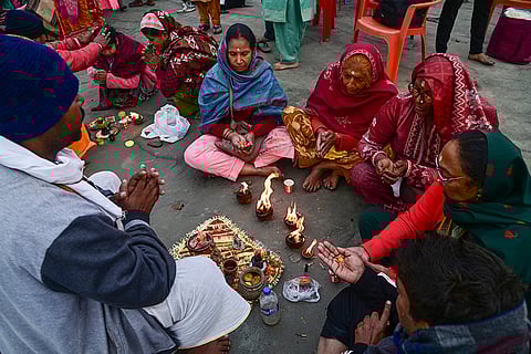 Devotees perform rituals ahead of the Gangasagar Mela, at the Sagar Island beach in South 24 Parganas, West Bengal.
