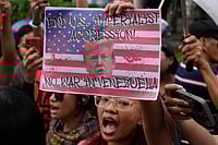 Emperor without Clothes: Trump's 'Crude' Pursuit Of Venezuelan Oil Aaron Favila : Protesters shout slogans while holding a picture of U.S. President Donald Trump as they denounce the U.S. government and Trump after the U.S. captured Venezuelan President Nicolas Maduro during a rally near the U.S. Embassy in Manila, Philippines on Monday