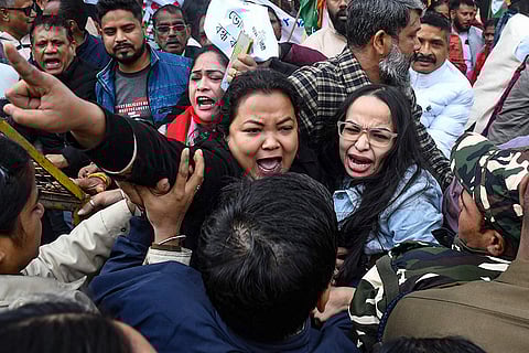 Security personnel try to stop agitators during a protest by Assam Pradesh Congress Committee alleging 'irregularities' in the draft electoral rolls of the state, published after a Special Revision (SR), in Guwahati.