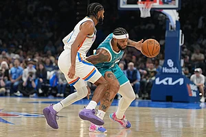 | Photo: AP/Kyle Phillips : Charlotte Hornets forwarad Miles Bridges, right, pushes past Oklahoma City Thunder guard Isaiah Joe during the second half of an NBA basketball game, in Oklahoma City.