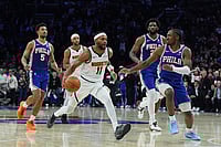 | Photo: AP/Matt Rourke : Denver Nuggets' Bruce Brown (11) tries to get past Philadelphia 76ers' Tyrese Maxey, right, during overtime of an NBA basketball game in Philadelphia. 