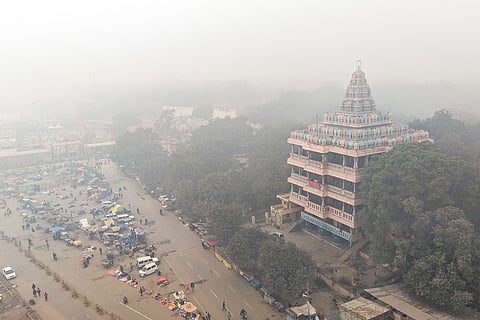 Adi Shankar Viman Mandapam engulfed in a dense layer of fog on a winter morning, in Prayagraj.