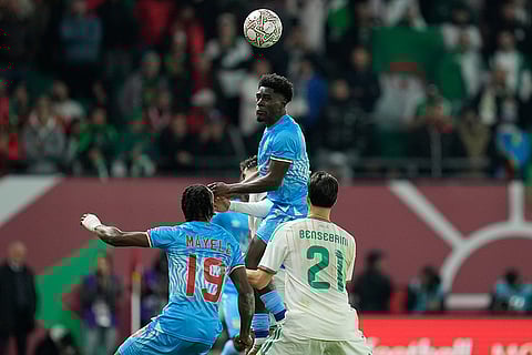 DR Congo's Dylan Batubinsika heads the ball during the Africa Cup of Nations round of 16 soccer match between Algeria and DR Congo in Rabat, Morocco.