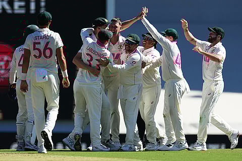 Australian players celebrate after the dismissal of England's Will Jacks during play on day four of the fifth and final Ashes cricket test between England and Australia in Sydney.