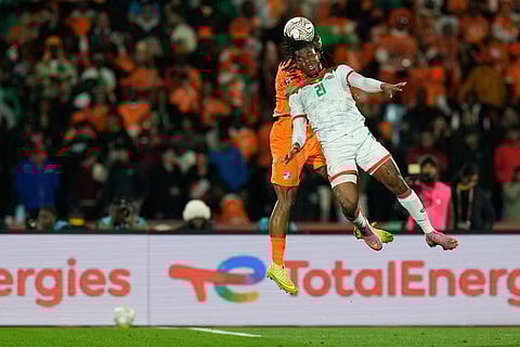 Burkina Faso's Irie Bi heads the ball during the Africa Cup of Nations best of 16 soccer match between Ivory Coast and Burkina Faso in Marrakech, Morocco.