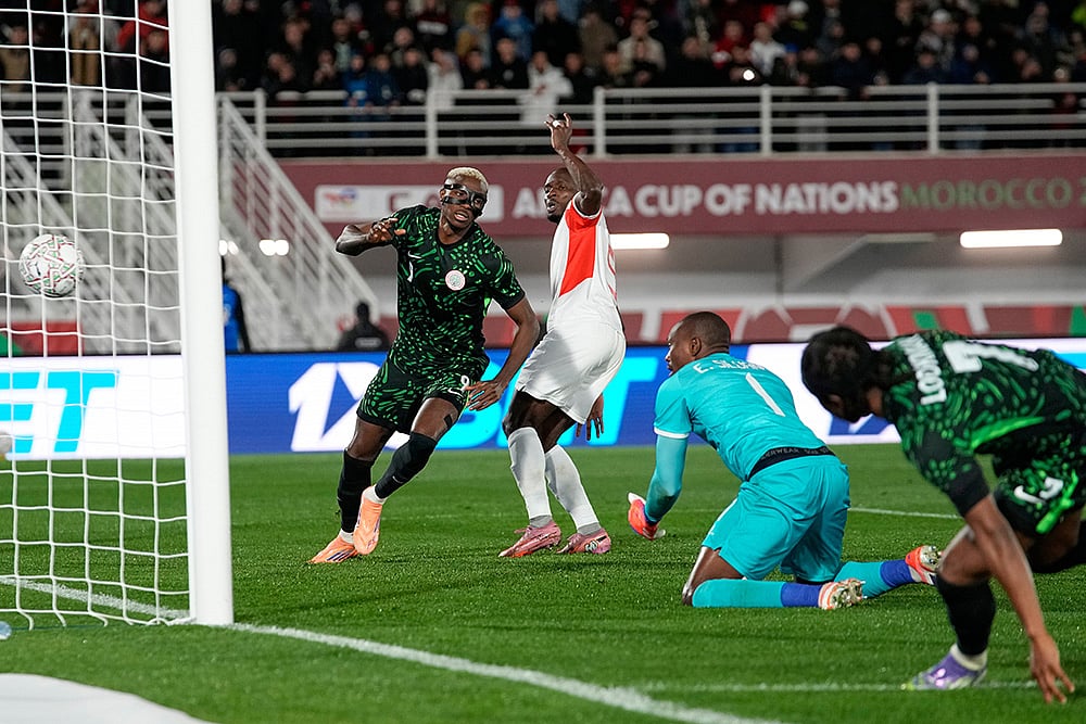 Nigeria's Victor Osimhen, left, celebrates after scoring his side's third goal during the Africa Cup of Nations round of 16 soccer match between Nigeria and Mozambique in Fez, Morocco. - | Photo: AP/Themba Hadebe