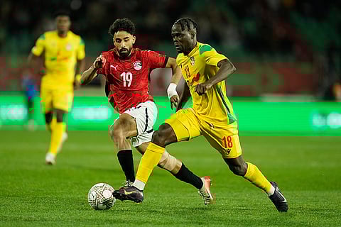 Egypt's Marwan Attia, leftm defends against Benin's Junior Olaitan during the Africa Cup of Nations round of 16 soccer match between Egypt and Benin in Agadir, Morocco.