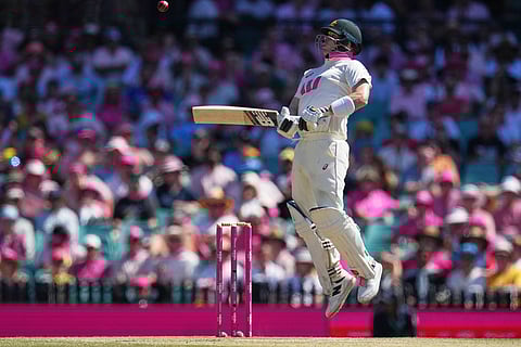 Australia's Steve Smith reacts during play on day three of the fifth and final Ashes cricket test between England and Australia in Sydney.