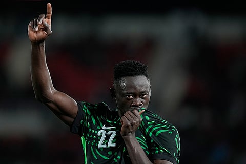 Nigeria's Akor Adams celebrates after scoring his side's fourth goal during the Africa Cup of Nations round of 16 soccer match between Nigeria and Mozambique in Fez, Morocco.