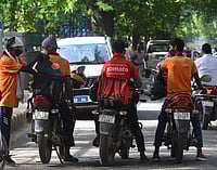 Ten Minutes To Nowhere: Is Ultra-Fast Service Delivery Model Eroding Rights? Tribhuvan Tiwari : Food delivery boys on wheels in New Delhi, India.