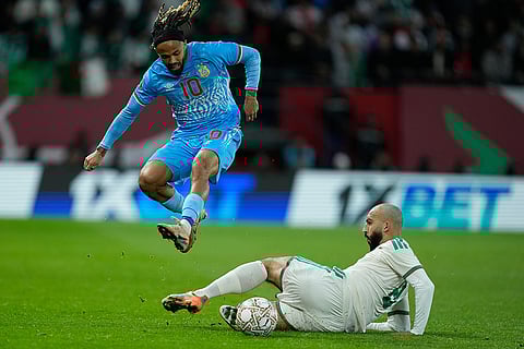 Algeria's Himad Abdelli, bottom, stops DR Congo's Theo Bongonda during the Africa Cup of Nations round of 16 soccer match between Algeria and DR Congo in Rabat, Morocco.