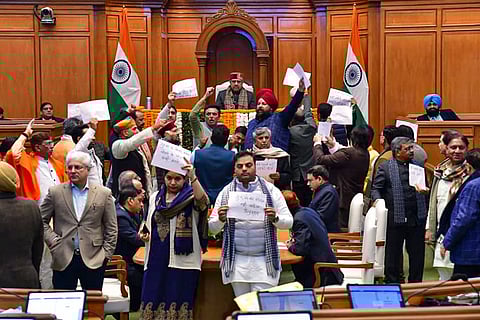 BJP MLAs protest against Leader of Opposition in the Delhi Assembly and AAP leader Atishi, demanding an apology from her for allegedly 'disrespecting' Sikh Guru Tegh Bahadur, during the Winter session of the Assembly, in New Delhi. 