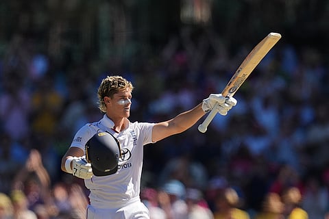 England's Jacob Bethell celebrates after scoring a century during play on day four of the fifth and final Ashes cricket test between England and Australia in Sydney.