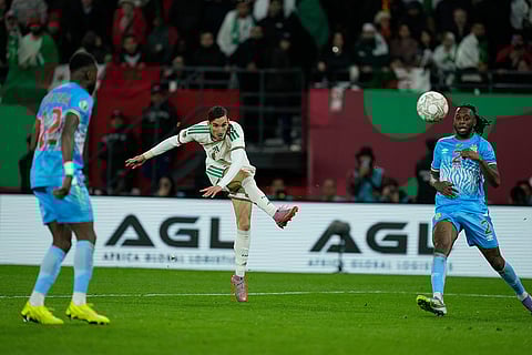 Algeria's Adil Boulbina scores his side's first goal during the Africa Cup of Nations round of 16 soccer match between Algeria and DR Congo in Rabat, Morocco.