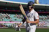AUS Vs ENG, 5th Ashes Test Day 4: Jacob Bethell's Maiden Century Keeps England In Game - In Pics | Photo: AP/Mark Baker : England's Jacob Bethell walks from the field at the close of play during on day four of the fifth and final Ashes cricket test between England and Australia in Sydney.