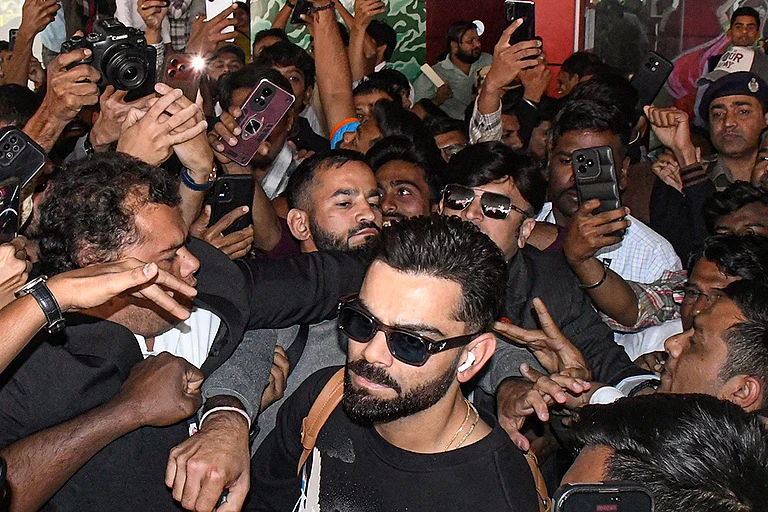 Cricketer Virat Kohli upon his arrival at Vadodara Airport ahead of India's ODI cricket series with New Zealand, Gujarat. - | Photo: PTI