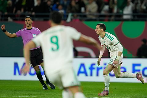 Algeria's Adil Boulbina celebrates after scoring his side's first goal during the Africa Cup of Nations round of 16 soccer match between Algeria and DR Congo in Rabat, Morocco.