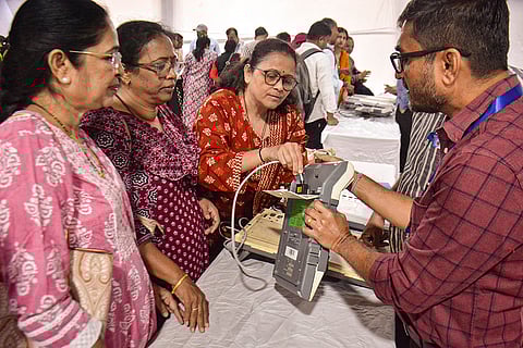 Polling officials take part in a training session on Electronic Voting Machines (EVMs) ahead of the Thane Municipal Corporation (TMC) election, in Thane, Maharashtra.